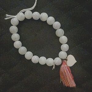 NWT BEADED STRETCH BRACELET WITH HEART CHARM AND TASSEL